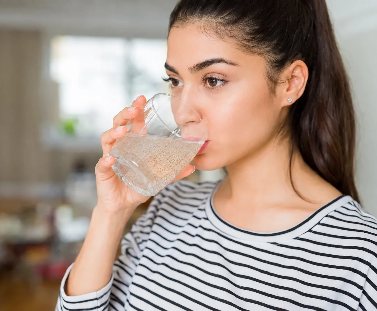 A glass of Roothealth fibre mid-fizz on a morning counter